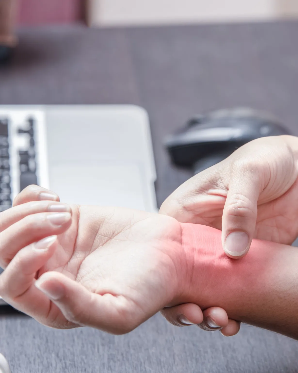 Chiropractor examining wrist for carpal tunnel syndrome in Lenexa, KS