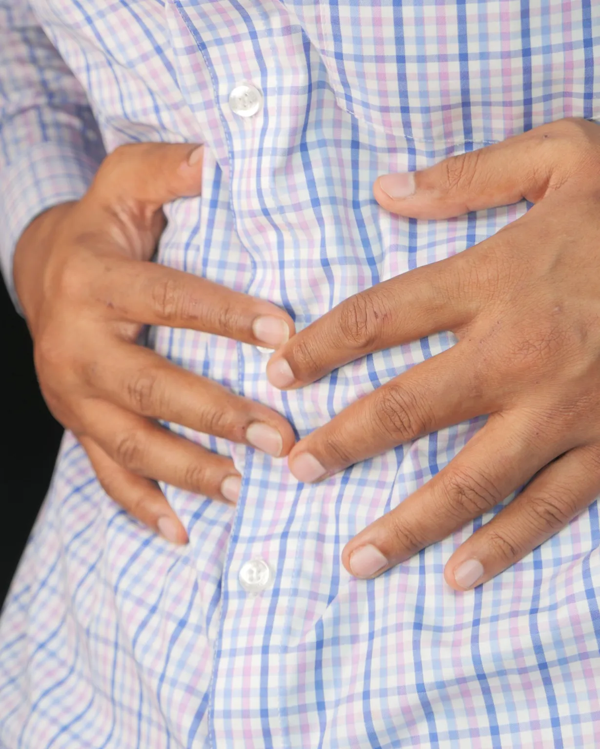 Chiropractor adjusting spine for digestive health and constipation relief in Lenexa, KS